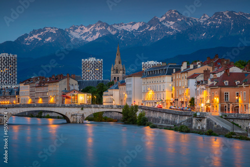 Cityscape image of Grenoble, France during twilight blue hour.