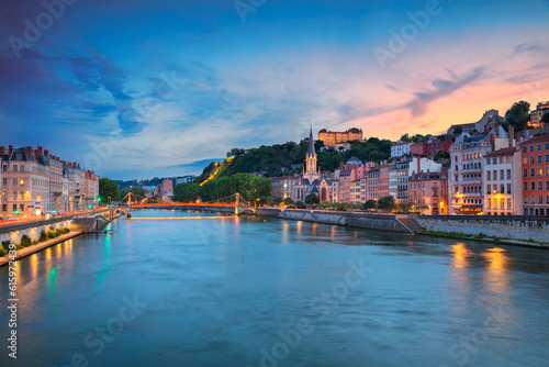 Cityscape image of Lyon, France during sunset.
