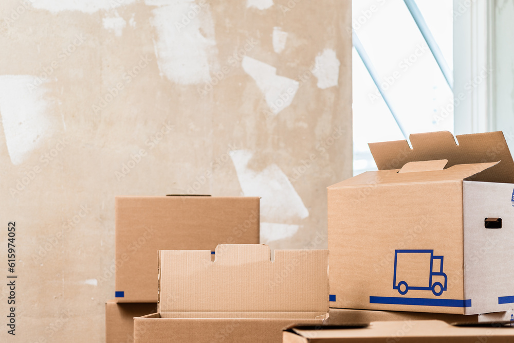 Heap of cardboard boxes used for moving in the interior of a