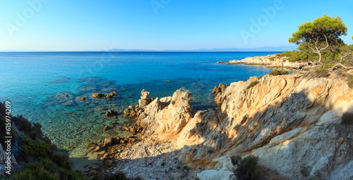 Aegean sea coast evening landscape with aquamarine water  view near Mega Portokali Beach  Sithonia  Chalkidiki  Greece . Two shots stitch panorama.