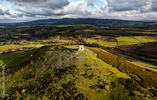 Dunnideer prehistoric hillfort c250 BC showing concentric ramparts. and ruined medieval Dunnideer Castle tower house. Near Insch, Grampian, Scotland photo