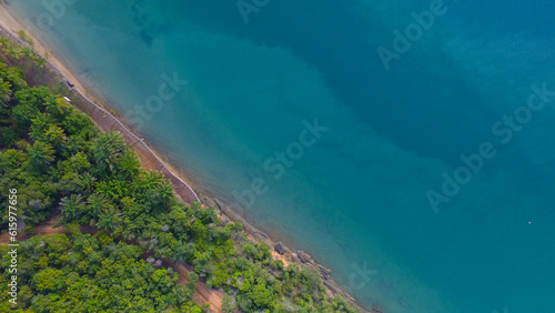 Coastline as a background from top view. Blue water and nature background from top view. Summer seascape from air. Travel image.