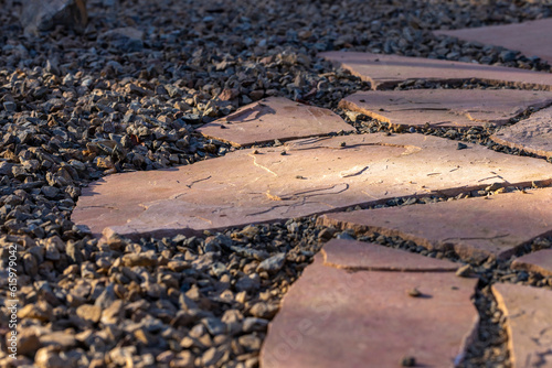 Flagstone and gravel backyard flooring landscape project