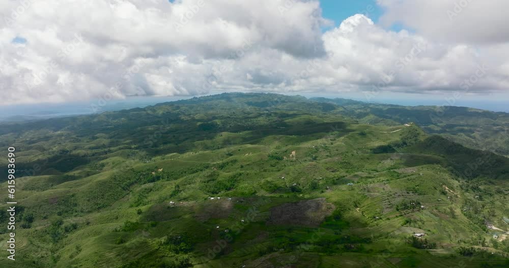 Aerial drone of agricultural land among mountains and hills in the countryside. Cebu island, Philippines. Aerial drone of agricultural land among mountains and hills in the countryside. Cebu island, Philippines.