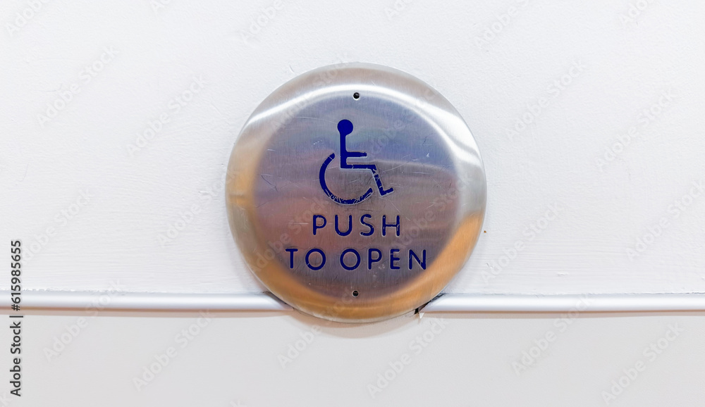 Close-up of a blue and white handicap sign, symbolizing accessibility, inclusivity, and accommodations for individuals with disabilities Close-up of a blue and white handicap sign, symbolizing accessibility, inclusivity, and accommodations for individuals with disabilities