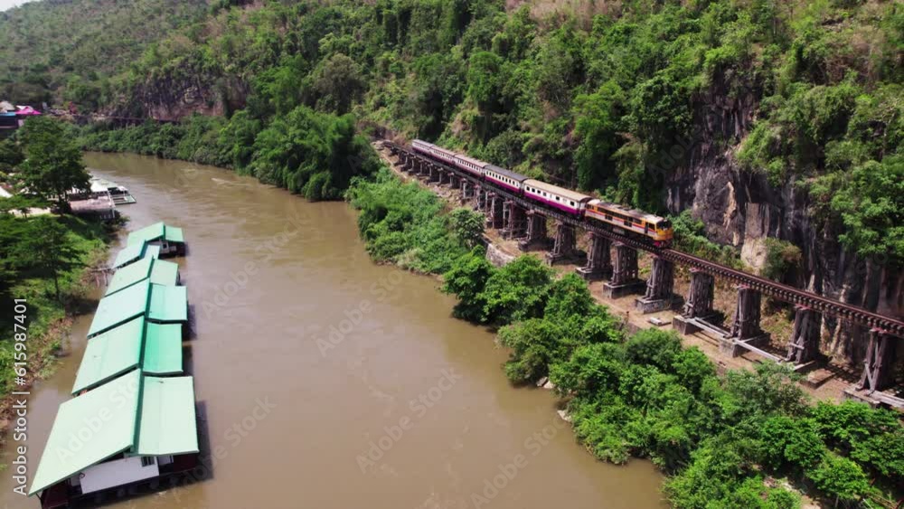 Aerial drone Thailand-Burma Railway Train Maeklong Death Railway bridge over the River Kwai JEATH on mountain pass Aerial drone Thailand-Burma Railway Train Maeklong Death Railway bridge over the River Kwai JEATH on mountain pass