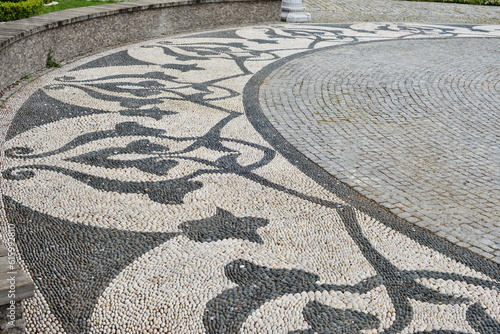 A floor decoration made of pebbles. Mosaic ornament.