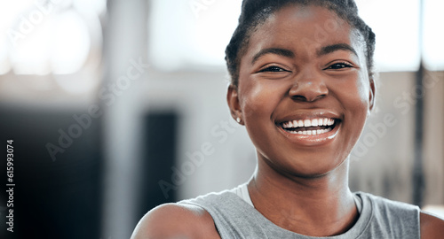 Break, portrait or black woman laughing in gym for a workout, exercise or training for fitness or wellness. Face of happy sports girl or funny female African athlete smiling with positive mindset