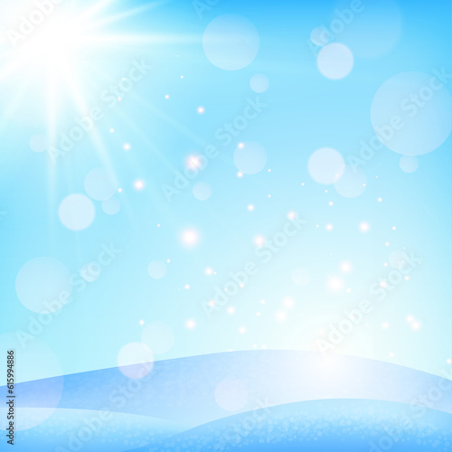 Blue spring or winter background. The sun shines in the snow. Clear skies and bokeh.