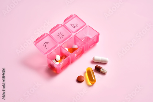 Tableau sur toile Bright pill box with different pills and vitamins.