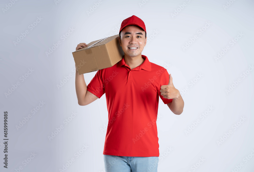 image of asian business man using laptop on blue background. image of asian business man using laptop on blue background.