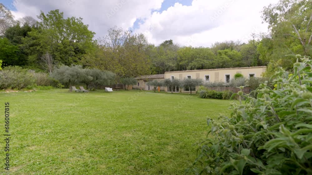 In the backdrop, a picturesque stone house stands proudly, surrounded by a lush green lawn dotted with majestic trees. In the backdrop, a picturesque stone house stands proudly, surrounded by a lush green lawn dotted with majestic trees.