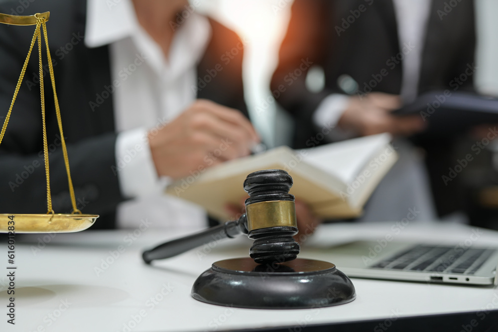 judge on wooden table And experienced lawyers meet with clients and give advice behind the scenes. legal services legal consulting concept judge on wooden table And experienced lawyers meet with clients and give advice behind the scenes. legal services legal consulting concept