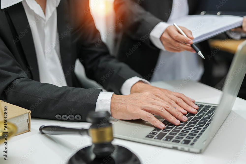 judge on wooden table And experienced lawyers meet with clients and give advice behind the scenes. legal services legal consulting concept judge on wooden table And experienced lawyers meet with clients and give advice behind the scenes. legal services legal consulting concept