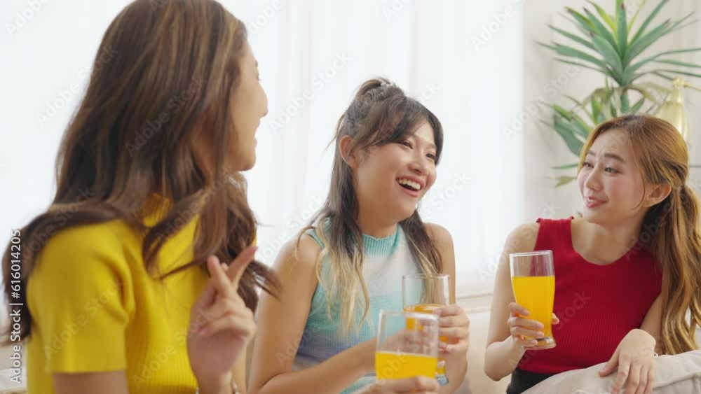 Group of Happy young Asian woman friends having meeting party together in living room at home. Attractive girl enjoy and fun reunion celebration party on summer holiday vacation. Youth culture concept Group of Happy young Asian woman friends having meeting party together in living room at home. Attractive girl enjoy and fun reunion celebration party on summer holiday vacation. Youth culture concept