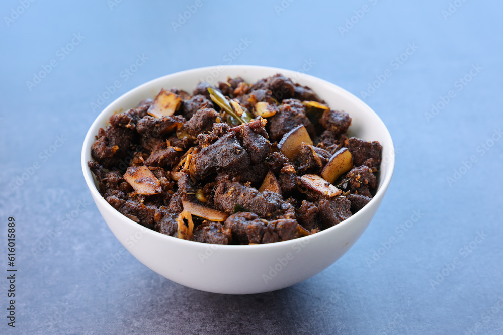 Kerala style beef or Mutton dry fry. delicious spicy Beef fry in clay pot . beef curry for ghee rice, kappa, appam, parotta, puttu, bread and chappathi, beef roast. Indian cuisine . Kerala style beef or Mutton dry fry. delicious spicy Beef fry in clay pot . beef curry for ghee rice, kappa, appam, parotta, puttu, bread and chappathi, beef roast. Indian cuisine .