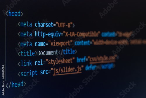 computer code written on a monitor in HTML language