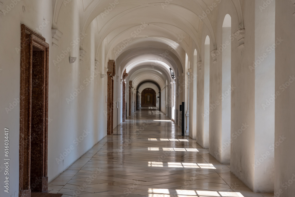 light flooded long corridor with many windows, perspective view