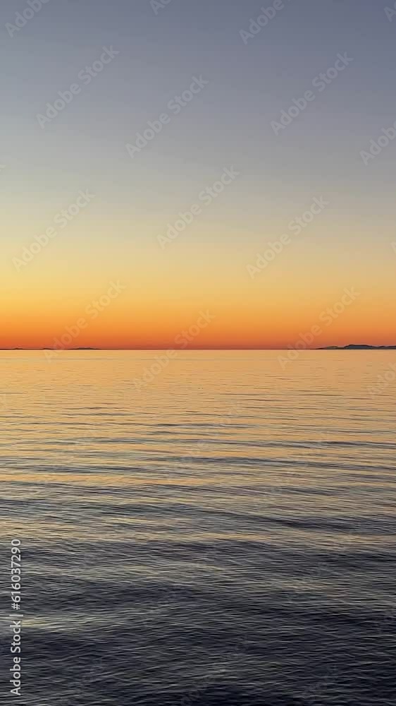 sunset against background of sea and sky and the horizon a strip of very bright rich red-orange color silence Calmness and relaxation evening sunset against background of sea and sky and the horizon a strip of very bright rich red-orange color silence Calmness and relaxation evening