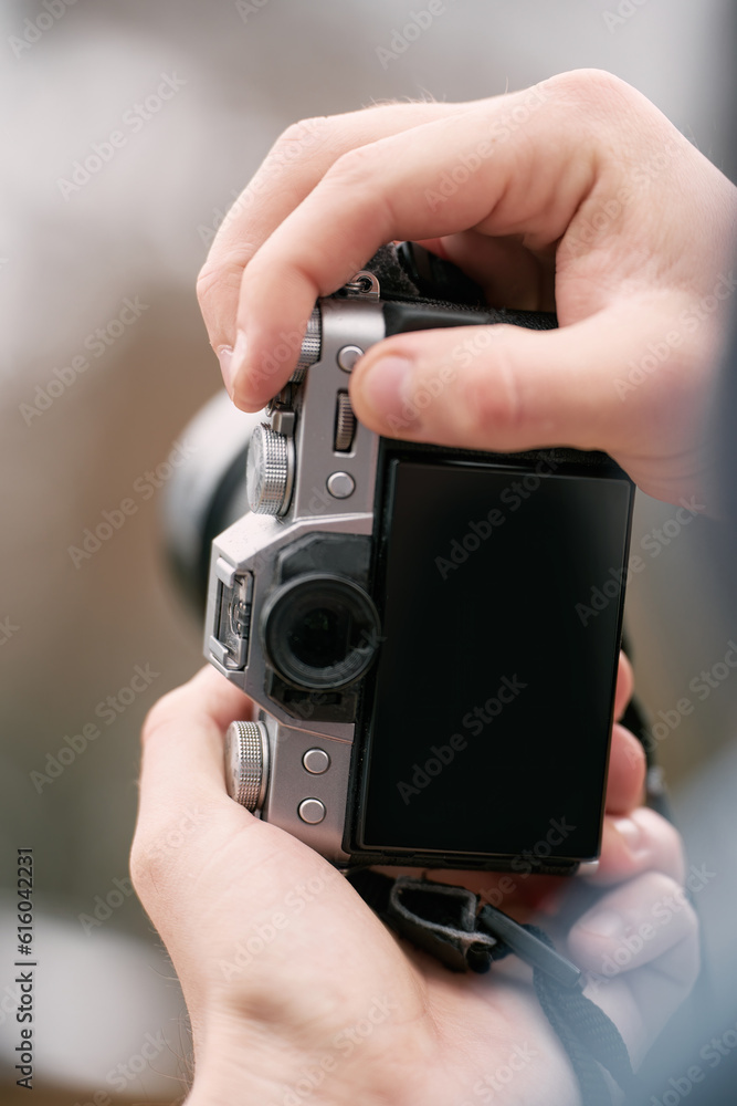 Man taking photos in beautiful outdoors. Traveling in Alps. Camera mockup Man taking photos in beautiful outdoors. Traveling in Alps. Camera mockup
