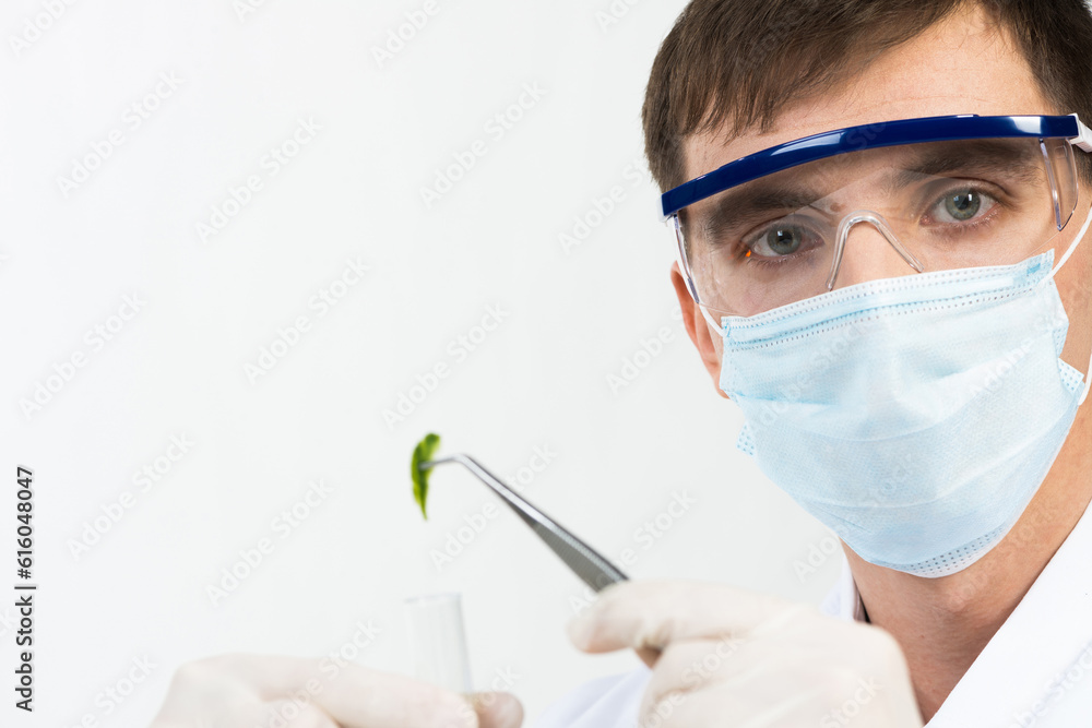 Scientist puts sample into test tube Scientist puts sample into test tube