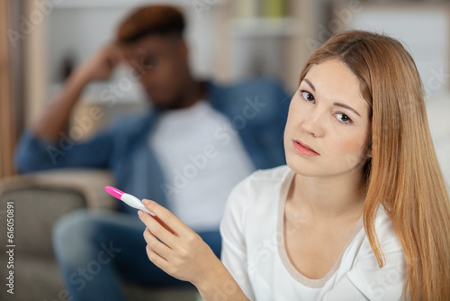stressed couple doing pregnancy test at home