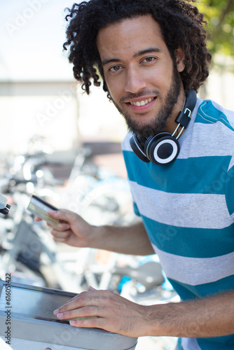 man rents a bike in a cith photo