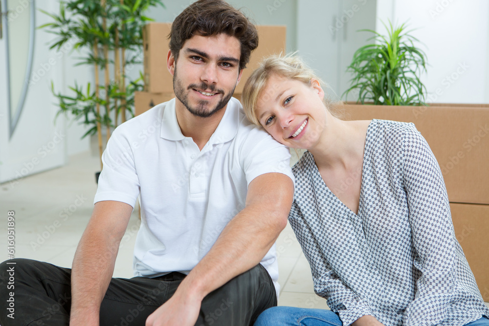 Fototapeta premium young couple moving in to new home together