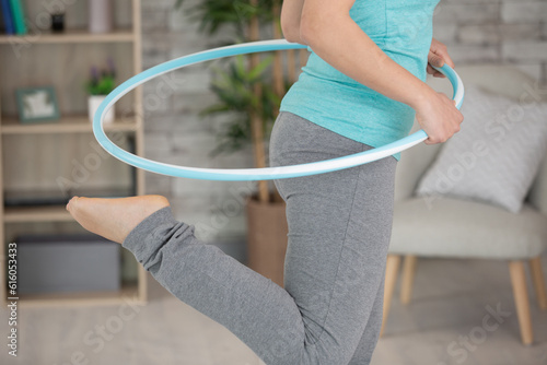 young attractive woman holding hula hoop photo
