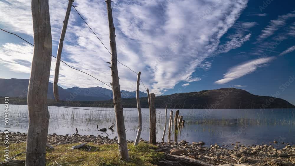 Timelapse of serene lake lezana, fast moving clouds against mountain backdrop Timelapse of serene lake lezana, fast moving clouds against mountain backdrop