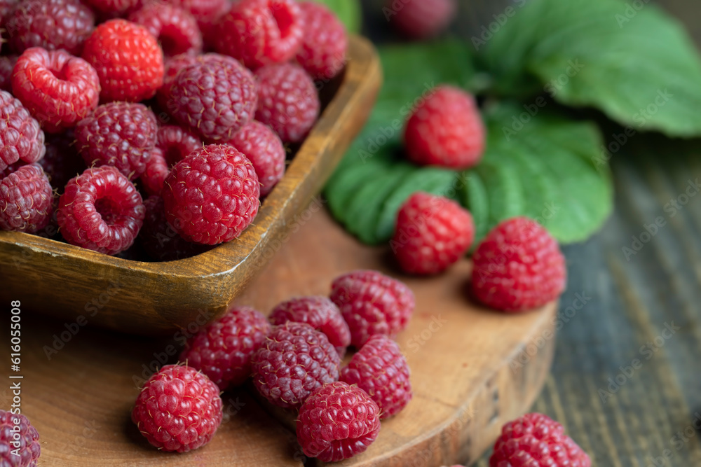 Ripe raspberries on a wooden board Ripe raspberries on a wooden board