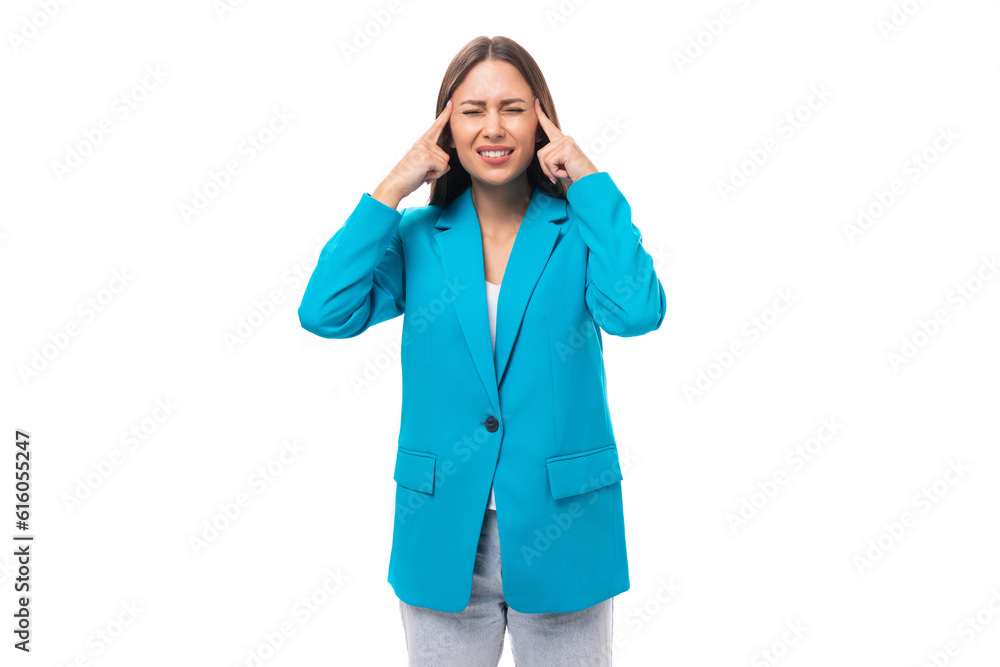 young indignant upset brunette secretary woman in a blue elegant jacket is worried on a white background with copy space young indignant upset brunette secretary woman in a blue elegant jacket is worried on a white background with copy space