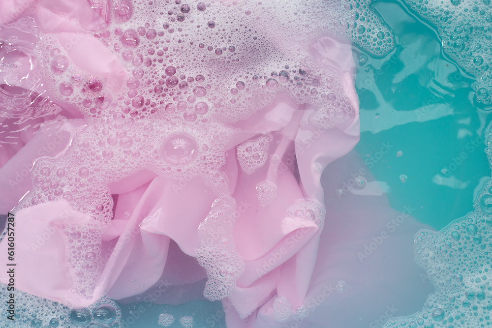 Clothes soak in powder detergent water dissolution, washing colored clothes Clothes soak in powder detergent water dissolution, washing colored clothes