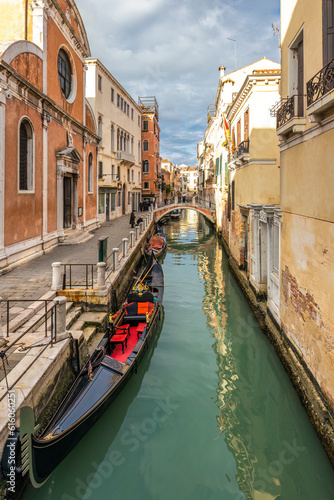 The Venice canal with gondola in the old town at sunny day. © Viliam