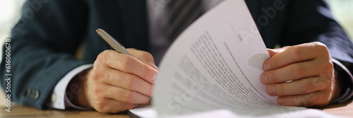 Obraz na płótnie Businessman leafing through documents and signing contract for business deal at work in office closeup. Certification of documentation and control concept w salonie