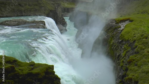 Slow motion footage of Gullfoss (Golden Waterfall) - waterfall located in the canyon of the Hvita river in southwest Iceland. photo