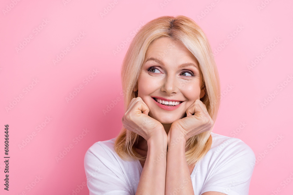 Closeup photo of adorable pensioner woman feel young showing perfect white teeth dream wear shirt isolated pink color background Closeup photo of adorable pensioner woman feel young showing perfect white teeth dream wear shirt isolated pink color background