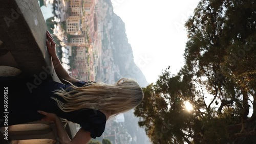 Cinematic Vertical Footage of Beautiful Woman Tourist in Monaco at Sunset photo