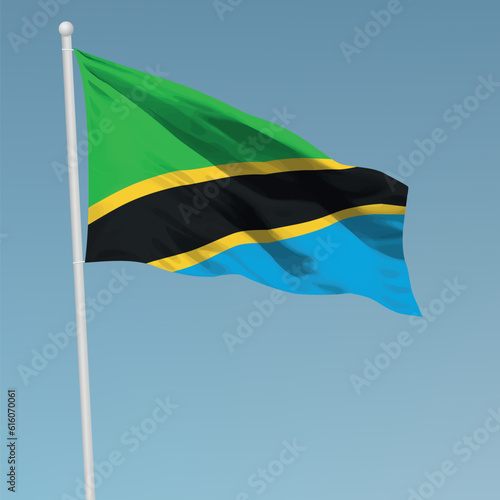 Waving flag of Tanzania on flagpole. Template for independence day