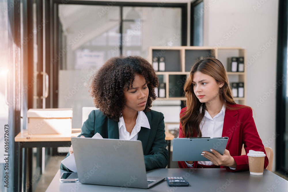 Team of international business people, teamwork, people and crisis concept - business team sitting sad and solving problems in the office. Team of international business people, teamwork, people and crisis concept - business team sitting sad and solving problems in the office.