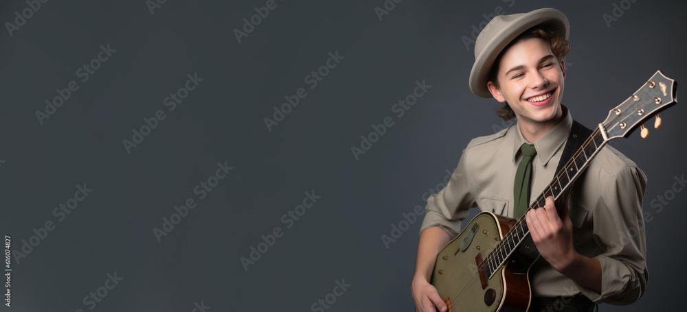 a smiling young men holding and playing a guitar in soft grey background generative ai a smiling young men holding and playing a guitar in soft grey background generative ai