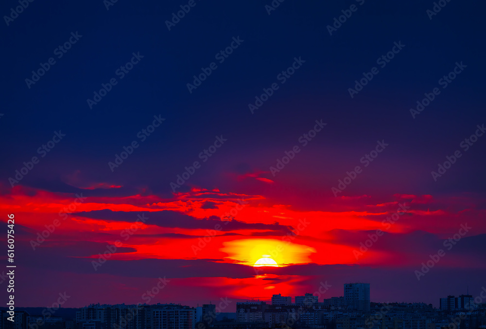 Beautiful sunset in the city with red sky