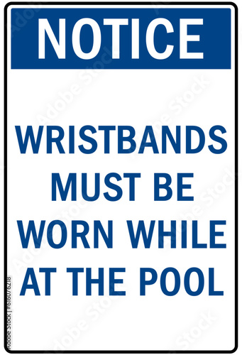 Pool pass required sign and labels wristbands must be worn while at the pool