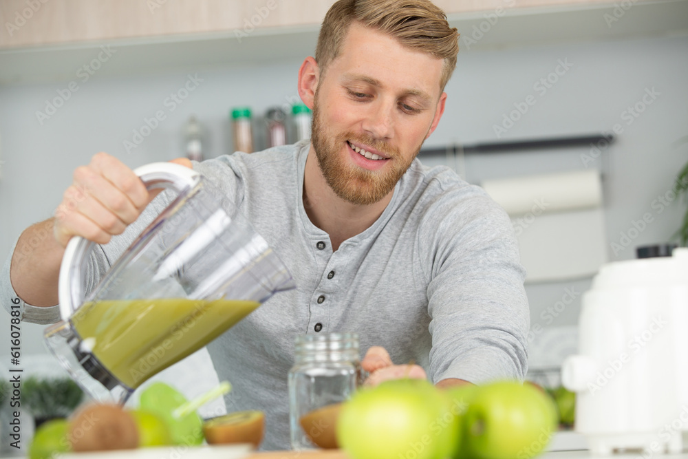 man having a table full of organic juice