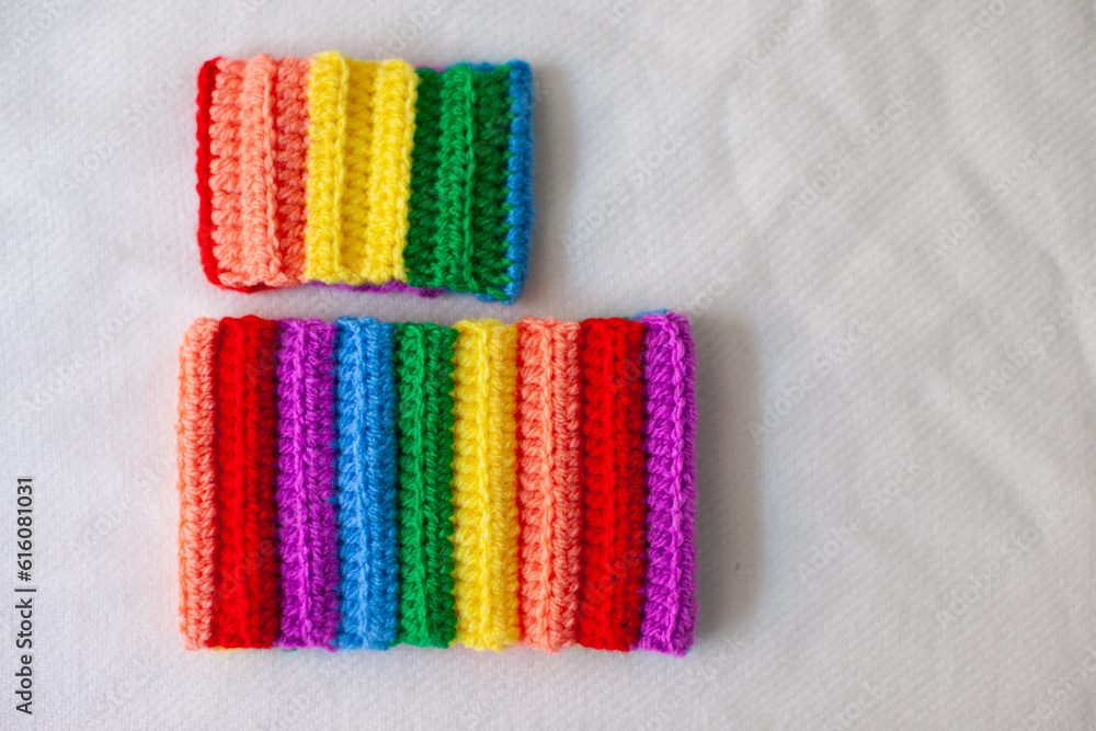 handmade crocheted rainbow bracelets as symbol of pride month isolated on white background handmade crocheted rainbow bracelets as symbol of pride month isolated on white background