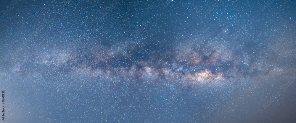 Obraz premium Panorama The sky, The Stars, the twinkling stars of the Milky Way solar system, visible to naked eye at night. There is noise due to shooting in low light.