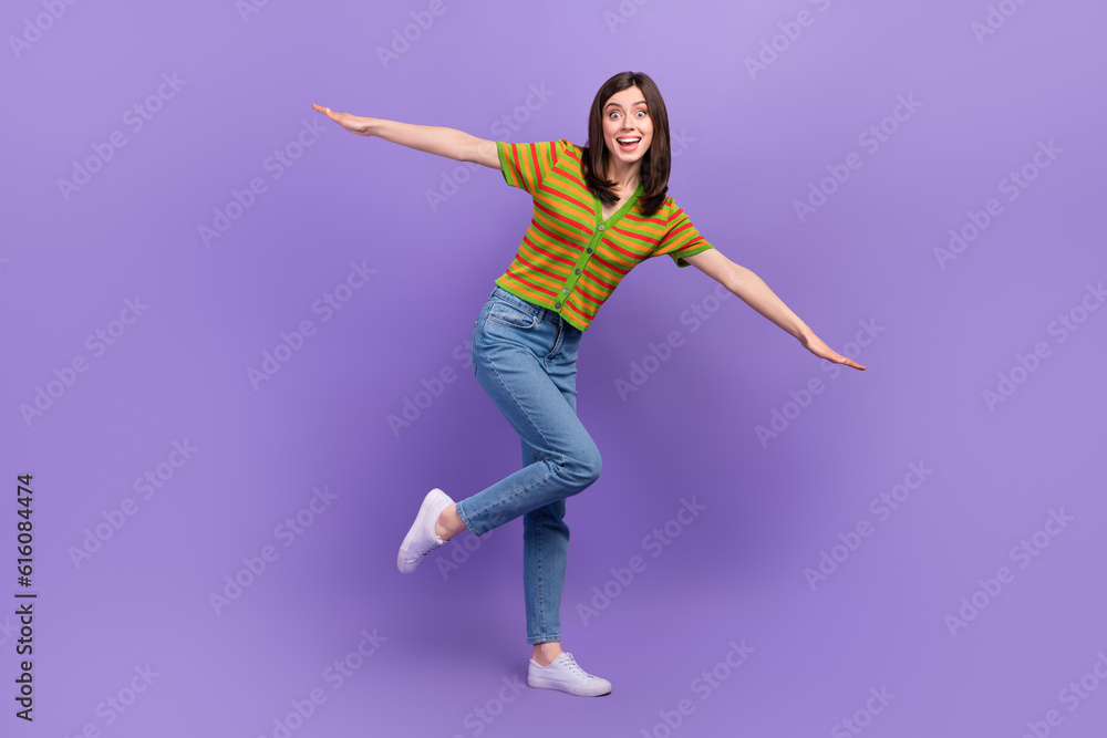Full length photo of cheerful excited lady wear stylish comfort outfit open two arms fly air isolated on purple color background
