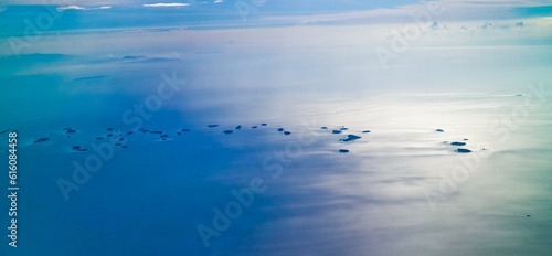 Aerial view of Jakarta's Thousand Islands against the blue sea in the background