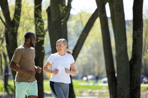 Man and woman having a morning run together in the park