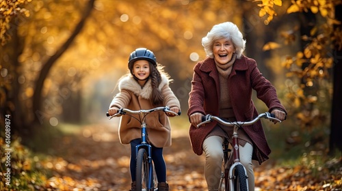 A grandmother and granddaughter going on a bike ride through a picturesque parkю